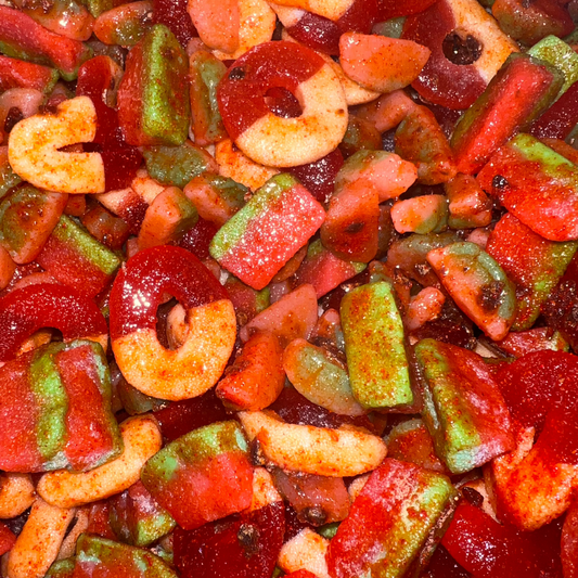 Assorted colorful gummy candies including heart and star shapes.
